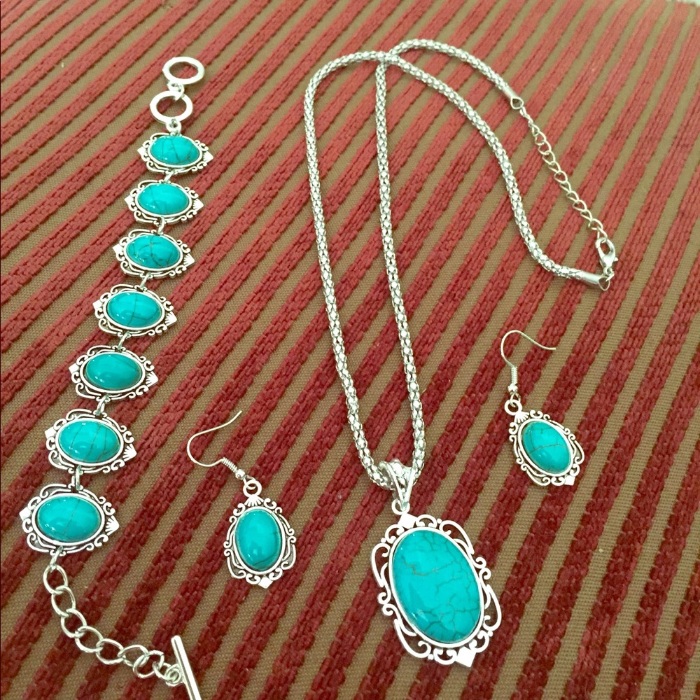 Silver Necklace, Earrings, & Bracelet.
